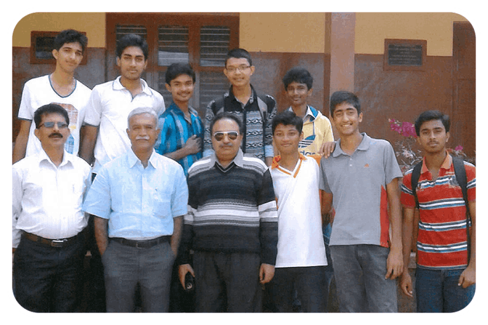 Mandappanda Chengappa, Founder President KESST (front row, second from left) with the children taking special maths coaching for NDA entrance examination.